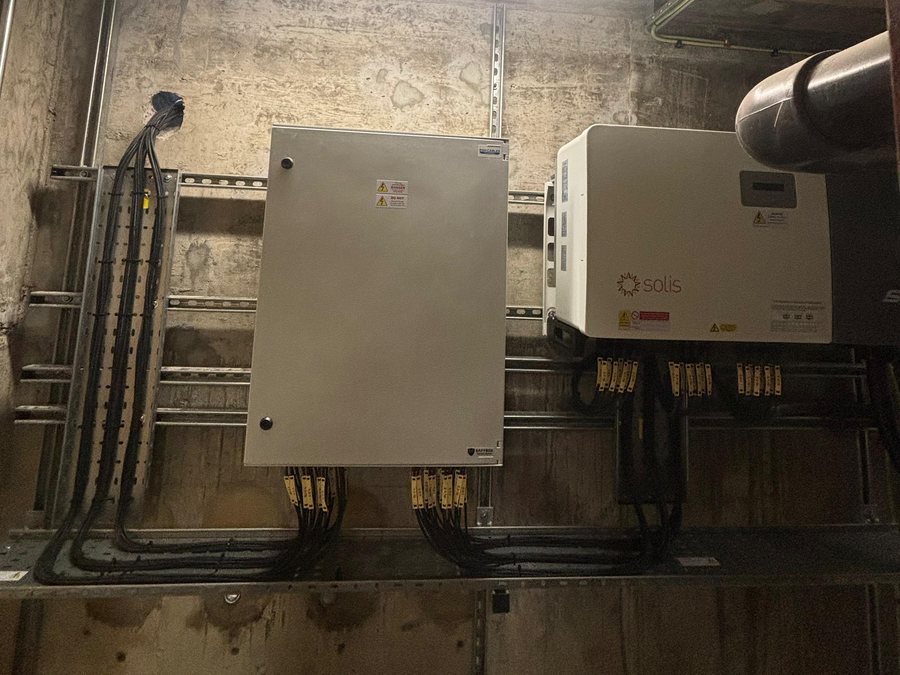 Inverter and isolator enclosures with containment and cabling